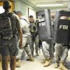 FBI agents training with ballistic shields in a building