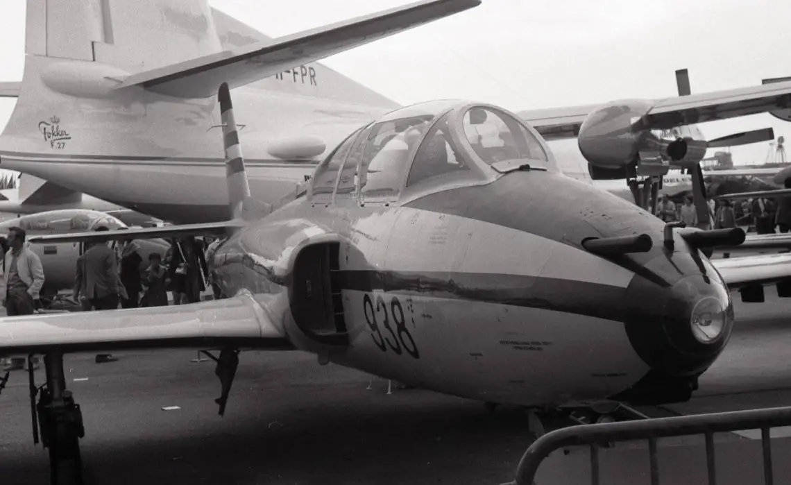 A photograph taken by J.F. Gueguin on June 5, 1971, at the Le Bourget air show near Paris. It showcases the new Galeb aircraft with a distinctive paint scheme on the front fuselage, featuring the number 938 displayed below the cabin and in front of the intake.
