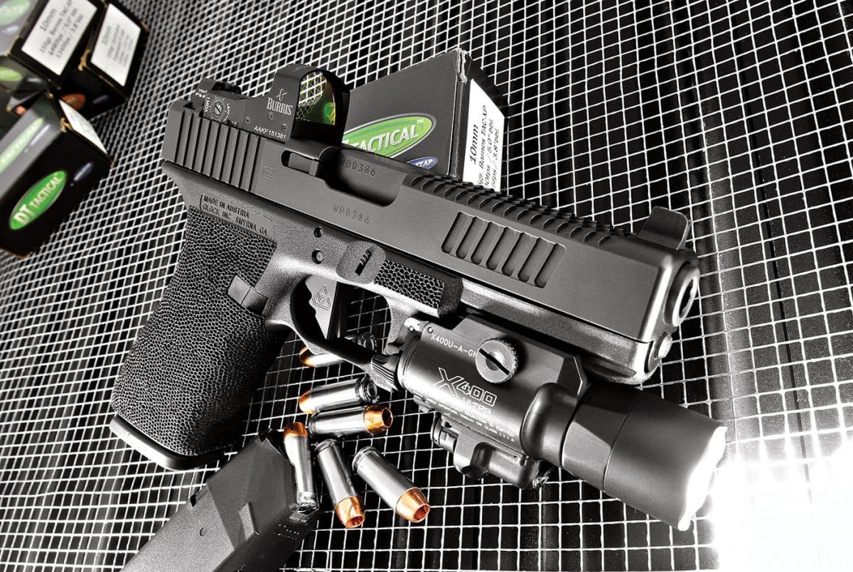 Glock 20 with optical sight and attached flashlight