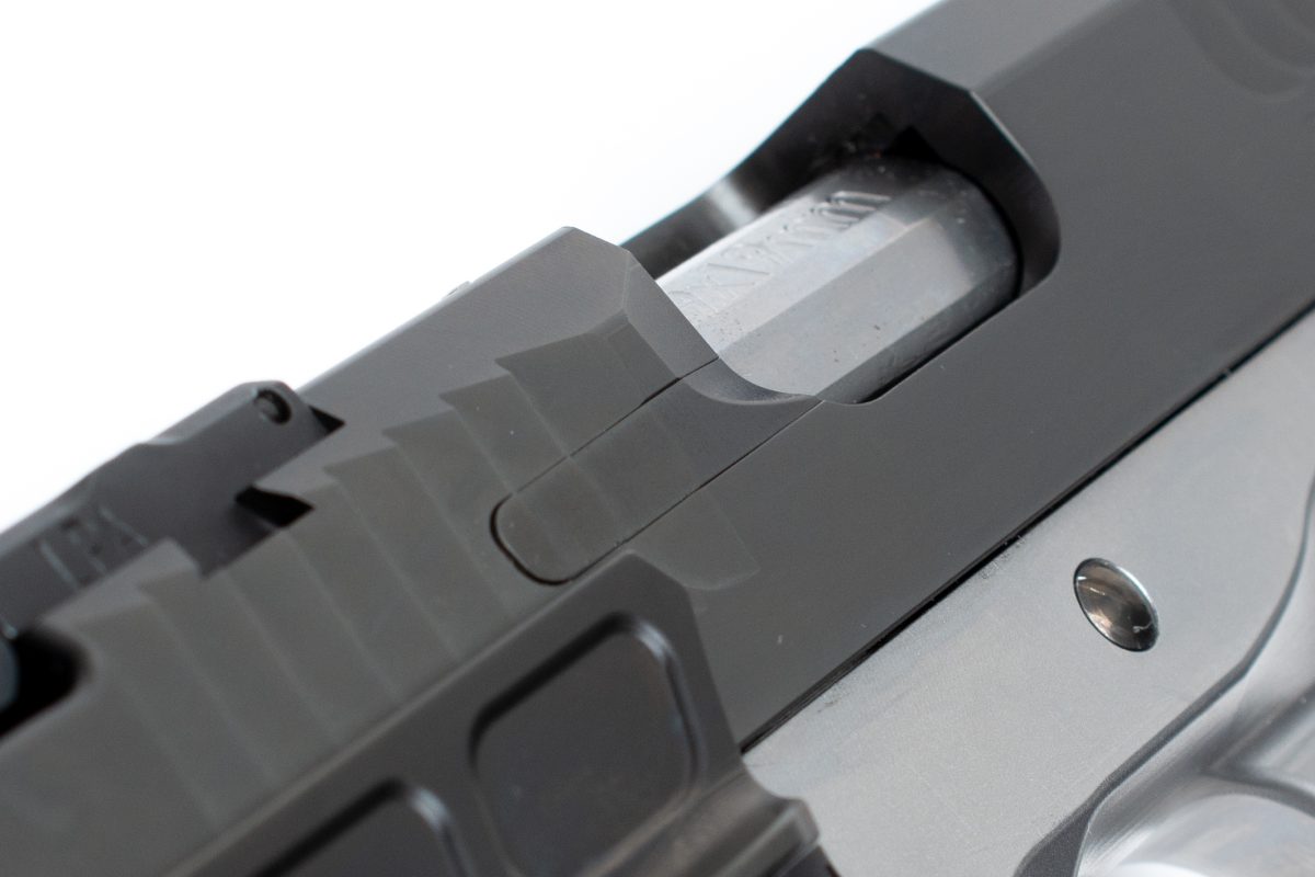Close-up of the Kratos 1911 ejector port, showcasing its precision and attention to detail