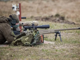 A Ukrainian soldier aiming with McMillan TAC-50 sniper rifle