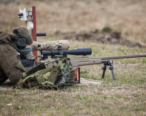 A Ukrainian soldier aiming with McMillan TAC-50 sniper rifle