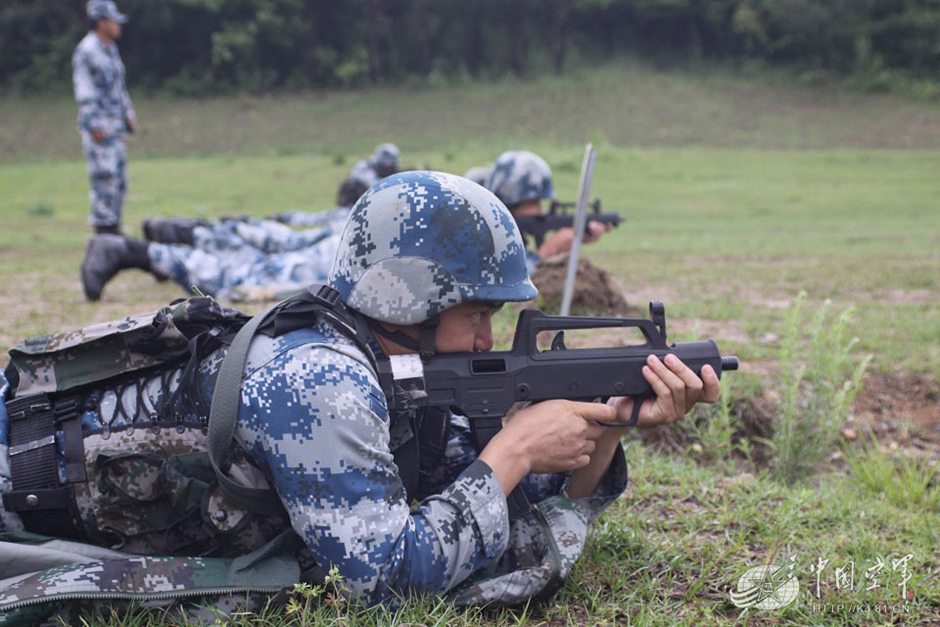 PLA soldier shooting from his QCW-05 or Type 05 submachine gun