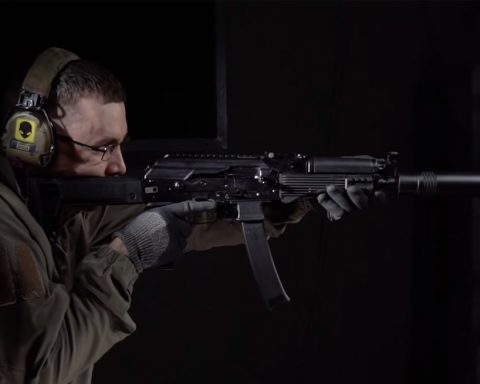 A man shooting from PPK-20 submachine gun