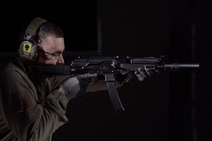 A man shooting from PPK-20 submachine gun