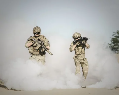 SASR operators moving through the smoke during the exercise