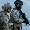 The operator from the SIPA SSU stands alongside his colleague from the US Special Forces