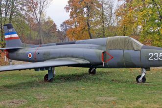 Soko J-21 Jastreb in front of hangar covered with protective equipment