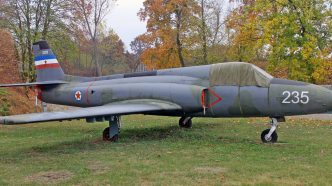 Soko J-21 Jastreb in front of hangar covered with protective equipment