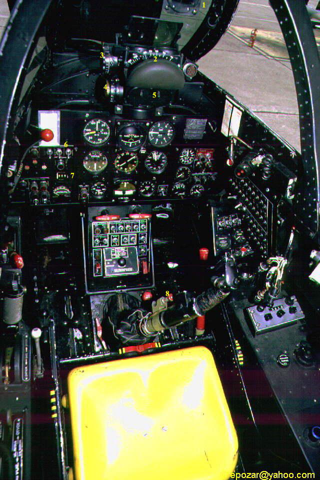 Close-up image capturing the front section of the Soko J-21 Jastreb cockpit, revealing the array of controls, instruments, and displays that form the pilot's domain, showcasing the advanced technology and functionality of the aircraft.