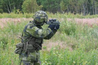 Swedish Soldier with CJB MS submachine gun