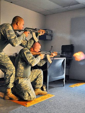 Two US soldiers firing Zastava M70 and AKM rifle during training