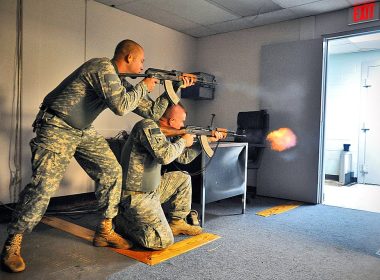 Two US soldiers firing Zastava M70 and AKM rifle during training