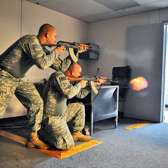 Two US soldiers firing Zastava M70 and AKM rifle during training