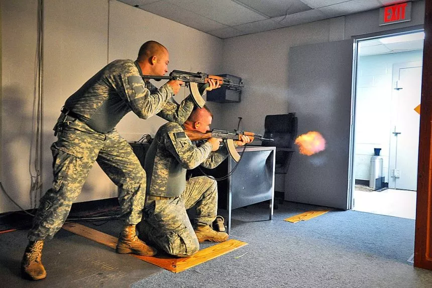 Two US soldiers firing Zastava M70 and AKM rifle during training