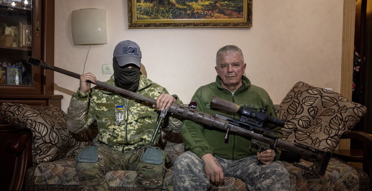 Vyacheslav Kovalskiy, pictured on the right, is accompanied by his spotter, holding the gun that fired the record-breaking shot at a Russian soldier.