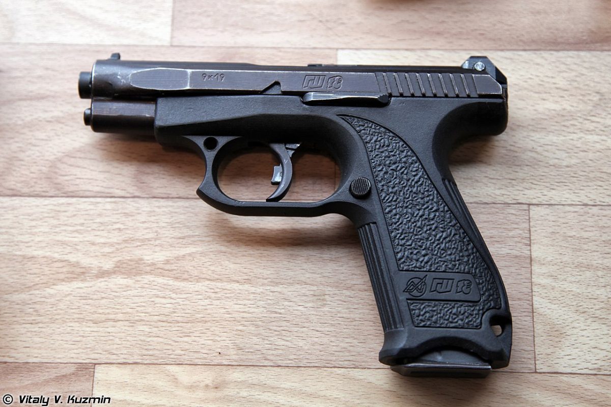 A close-up image of the GSh-18 pistol, showcasing its sleek design and advanced features