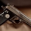 A Tariq 9mm pistol on a brown background