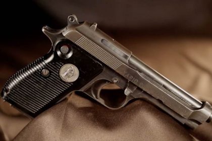 A Tariq 9mm pistol on a brown background
