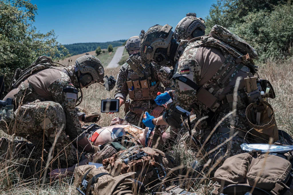 Operators of the SanSpezZg (Medic specialists) of the German KSK doing a complicated field surgery exercise