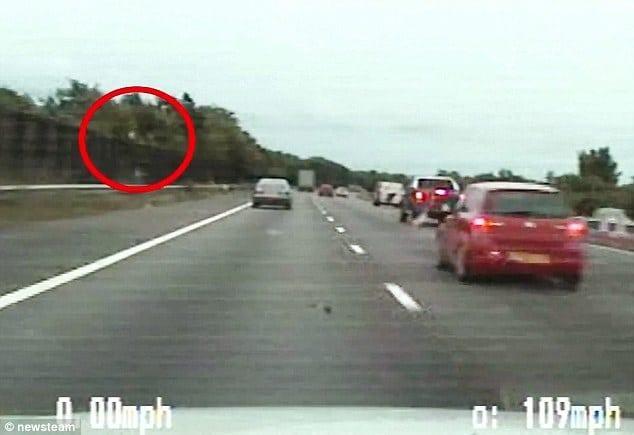 West Midlands Police say the dash-cam footage of the dramatic moment a drug dealer throws £200,000 of heroin from his car is the force's pursuit of the year. The 12-mile chase happened along the M6